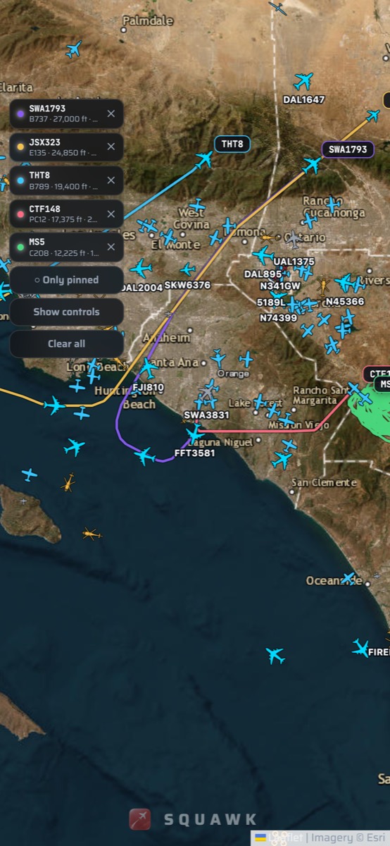 Pinned aircraft with colored trails on the Squawk map